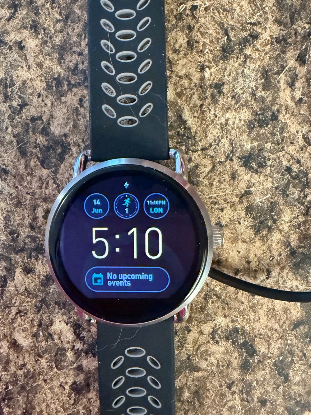 Fossil Q Wander Smartwatch with silicone and silver metal band and charger